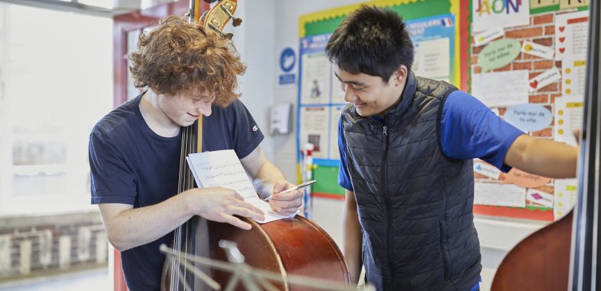 Double bass players at a rehearsal