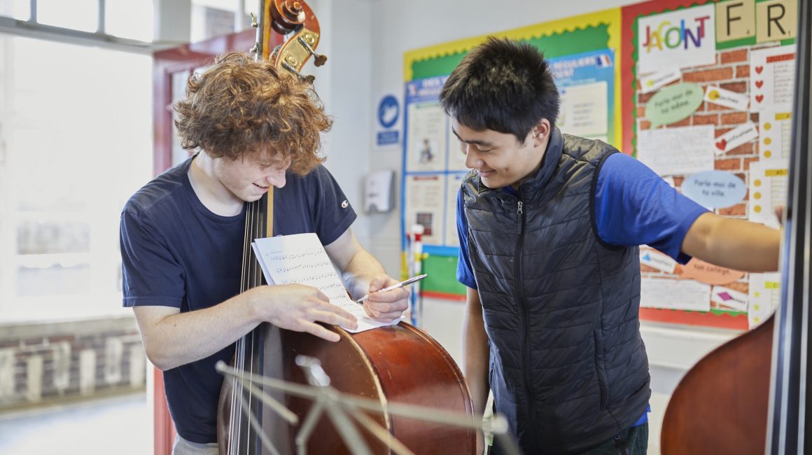 Double bass players at a rehearsal