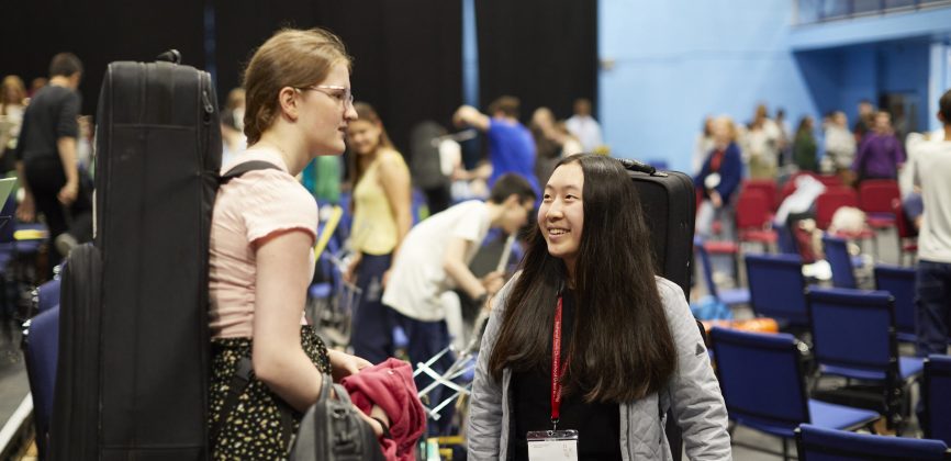 Alicia meeting another musician at a rehearsal