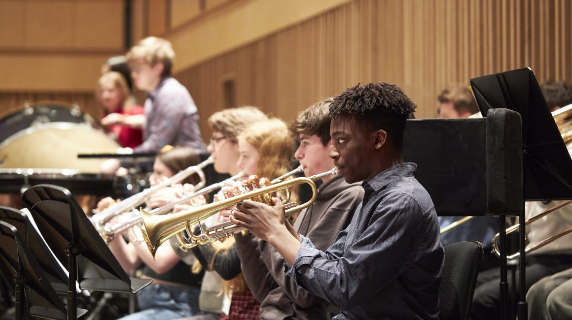 Michael playing trumpet at a rehearsal